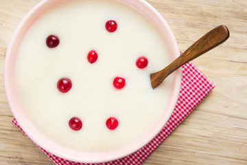 Semolina milk soup in bowl. Baby food.