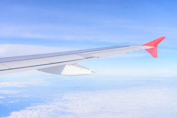 Obraz premium Looking through window aircraft during flight in wing with a nic
