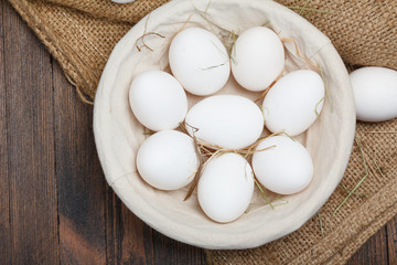 Eggs in a bowl on wooden table