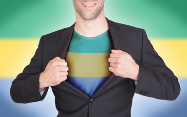 Businessman opening suit to reveal shirt with flag