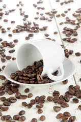 freshly roasted coffee beans and cup