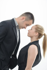 Colleagues shouting against each other on white background