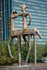 A bronze statue featuring a rider on horseback