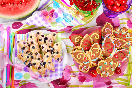 butterfly shaped gingerbread and puff pastry cookies with bluebe