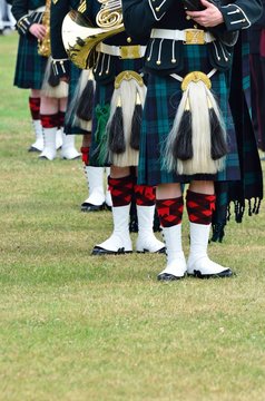 Line of musiicans in Kilts