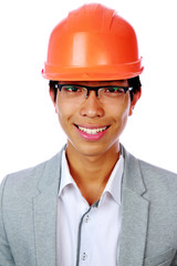 Portrait of a happy asian man in helmet over white background