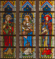 Obraz na płótnie Canvas Bruges - Madonna with saints on windowpane in st. Giles church