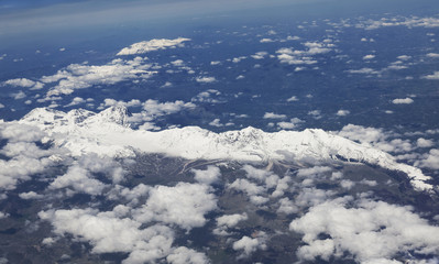 The plane is flying over the Dolomites