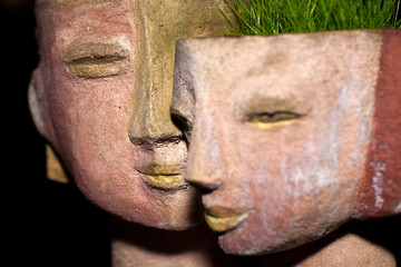 the flower pot in the form of the feminine head