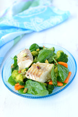 Braised fish (haddock) with vegetables.