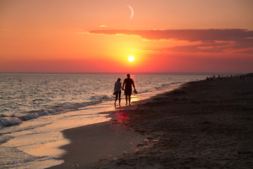 girl near the sea at sunset