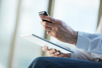 man holding digital tablet