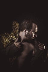 Steampunk, man beard and suit made with golden wings