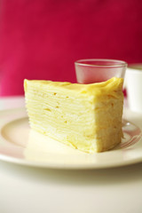 close up crepe cake in white dish