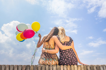 Woman releasing balloons