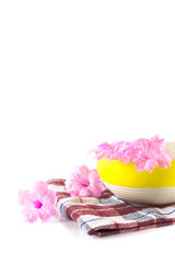 ceramic bowl with pink flower on a cloth