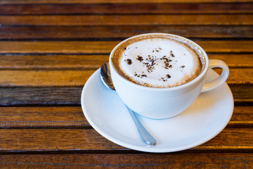 Cappuccino coffee on wood table