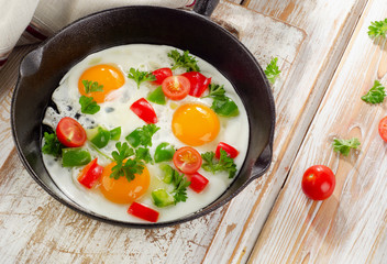 Fried eggs and vegetables