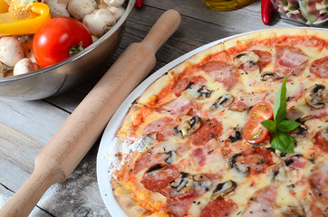 The Italian pizza with olives and a salami