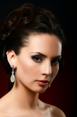 The beautiful woman in jewelry earrings