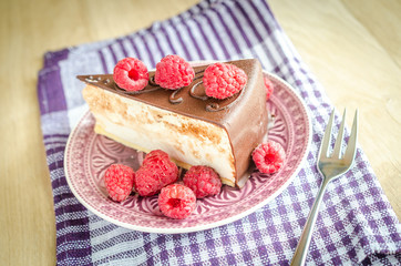 Chocolate cake decorated with fresh raspberries