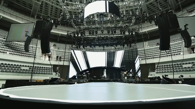 Lights and sound set-up at concert.  Black, white, gray tones
