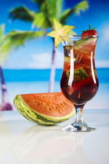 Tropical drink on beach and sun 