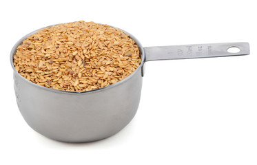 Golden linseed in an American cup measure