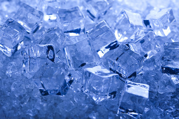 Ice cubes on blue background 