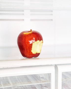 Bitten apple in the fridge
