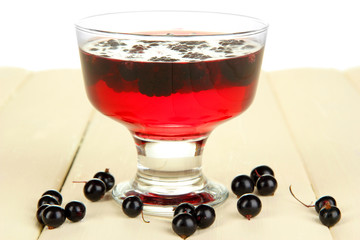 Jelly with fresh berries on wooden table