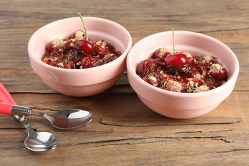 Tasty cherry dessert on table