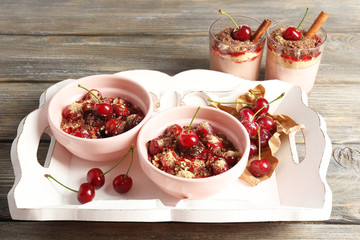 Tasty cherry dessert on table