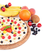 Sweet pizza with fruits close-up