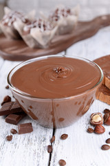 Sweet chocolate cream in bowl on table close-up