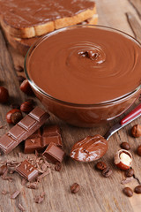 Sweet chocolate cream in bowl on table close-up