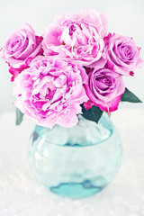 floral composition with a peony and roses flower