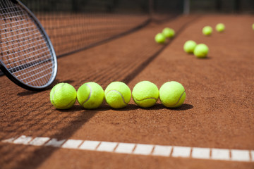 Tennis racket and balls, court