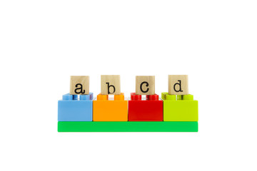 abcd word on wood stamps and colorful toy blocks