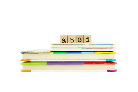 abcd word on wood stamps and children's board books Stock Photo | Adobe  Stock