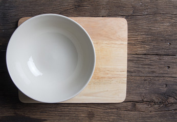 White ceramic bowl on wooden table