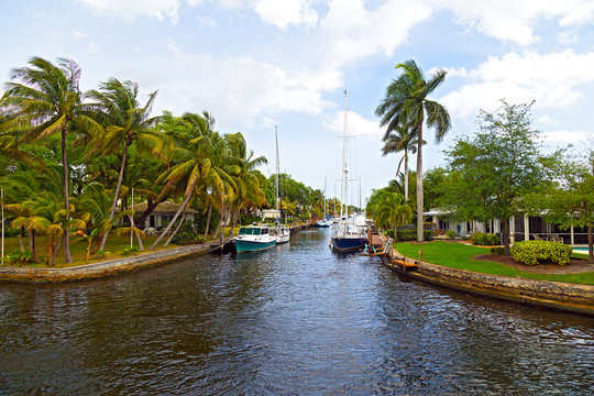 Motorboats Moored Along The Canal In Suburb Of Miami, Florida.