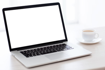 laptop computer with isolated screen is on the table in a white