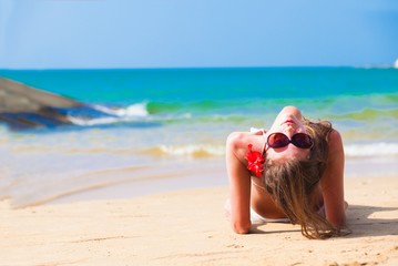 long haired woman in bikini on tropical beach