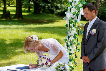 beautiful blonde smiling bride signed contract