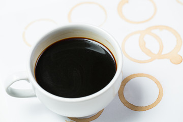 Obraz na płótnie Canvas Cup and foot printed of coffee o