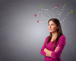 Young woman thinking with abstract marks overhead