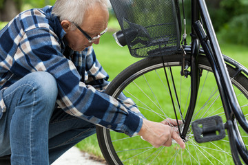 Man repairing bicycle wheel