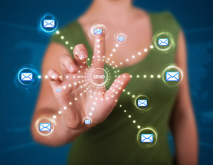 Woman pressing virtual messaging type of icons