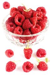 Raspberries in bowl isolated on white